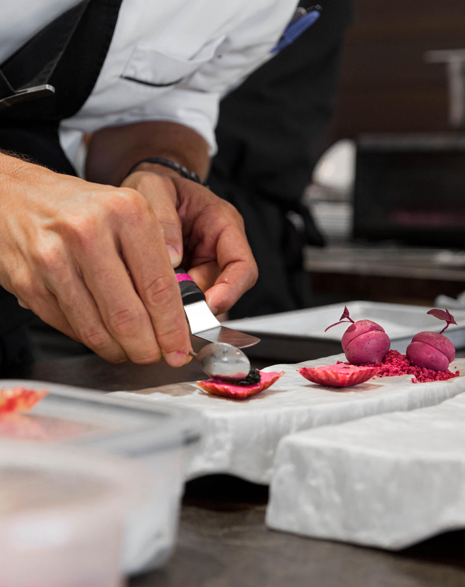 Instructor demonstrating precise knife technique